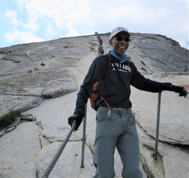 Kevin (our finance director) on the Half Dome cables, by Pete Devine (our resident naturalist)